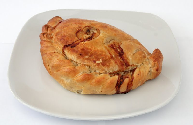 A Cornish Pasty made by Warrens ? Photo by David Johnson [1], CC BY-SA 3.0, via Wikimedia Commons
