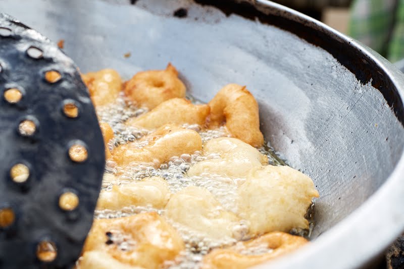 Pinkaso, is a Hausa savoury fried dumpling. It is served either as an accompaniment to a main meal or as a snack with Stew. It is also a northern Nigeria delicacies made with pure wheat powder, flour or mixture of both eaten with soup, honey or sugar. ? Photo by Issac Gyamfi, CC BY-SA 4.0, via Wikimedia Commons