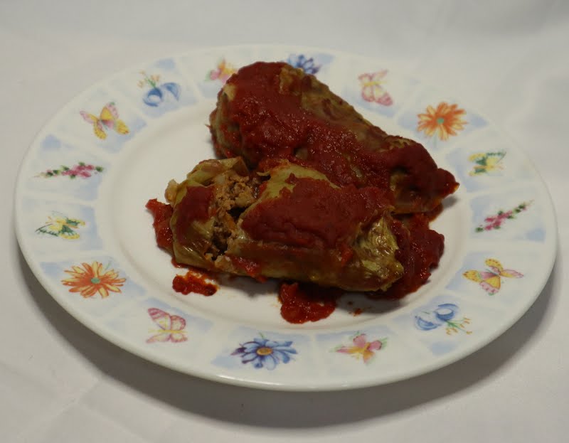 Two cabbage rolls filled with turkey and barley, covered with tomato sauce, served on a plate. ? Photo by Cnrowley, CC BY-SA 4.0, via Wikimedia Commons
