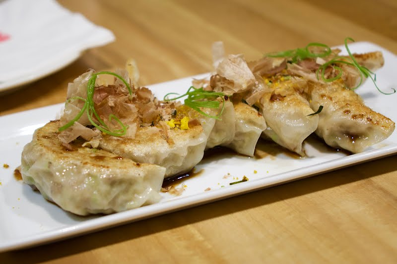 Japanese pan fried gyoza topped with nori and bonito flakes ? Photo by Adryan R. Villanueva, CC BY-SA 4.0, via Wikimedia Commons
