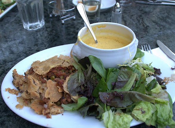 Corned beef pie, served with a cheddar soup and salad ? Photo by Ed Bierman, CC BY 2.0, via Wikimedia Commons