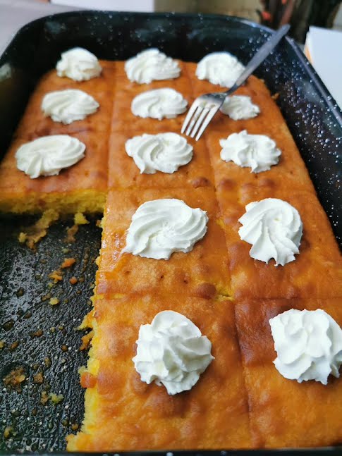 Revani (also namoura, basbousa, hareseh and other names) is a traditional Middle Eastern sweet cake that originated in Egypt, though also popular in other countries. It is made from a semolina batter in a pan, sweetened with orange flower water, rose water or simple syrup, and typically cut into diamond shapes ? Photo by Biser Todorov, CC BY-SA 4.0, via Wikimedia Commons