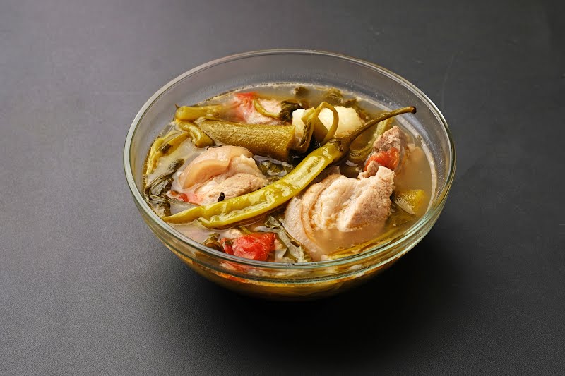 Filipino comfort food! Made with pork ribs, vegetables, and tamarind-flavored broth, it?s hearty and delicious on its own or served with steamed rice. ? Photo by Joy D. Ganaden, CC BY-SA 4.0, via Wikimedia Commons