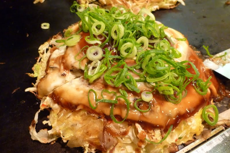 Okonomiyaki ? Photo by Nesnad, CC BY-SA 3.0, via Wikimedia Commons
