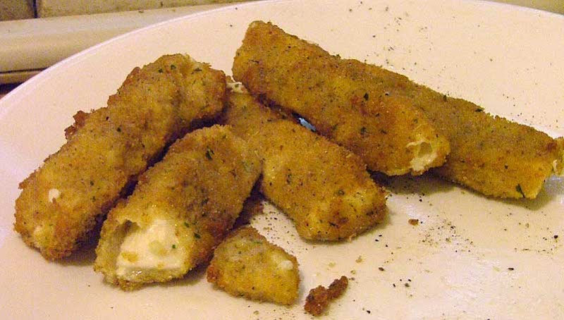 Fried mozzarella sticks. ? Photo by Alvis at English Wikibooks, Public domain, via Wikimedia Commons