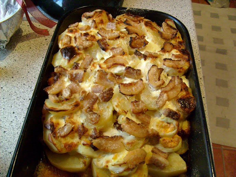 Rakott krumpli - a Hungarian dish made of layered potato with eggs, bacon and sausage ? Photo by zolakoma, CC BY 2.0, via Wikimedia Commons