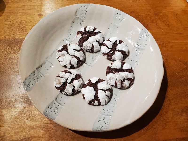 A plate of six cookies made according to the Wikibooks Cookbook recipe "Chocolate Crinkles". ? Photo by John V. Pozniak, CC BY-SA 4.0, via Wikimedia Commons