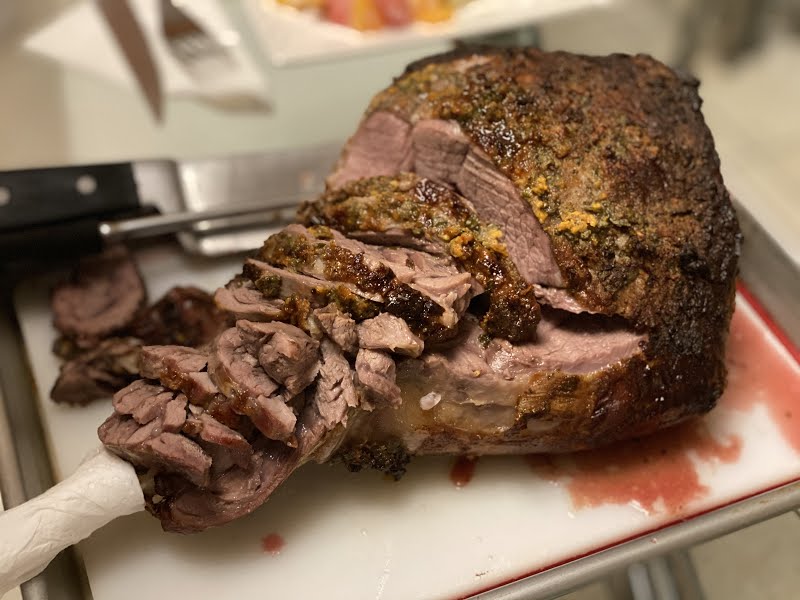 finished roast, cut along the bone, then into slices