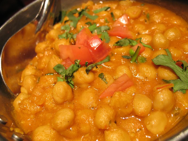Picture of chana (chick peas) masala at Le Taj restaurant.Channa masala ? Photo by Simon Law (sfllaw) from Montr�al, QC, Canada, CC BY-SA 2.0, via Wikimedia Commons