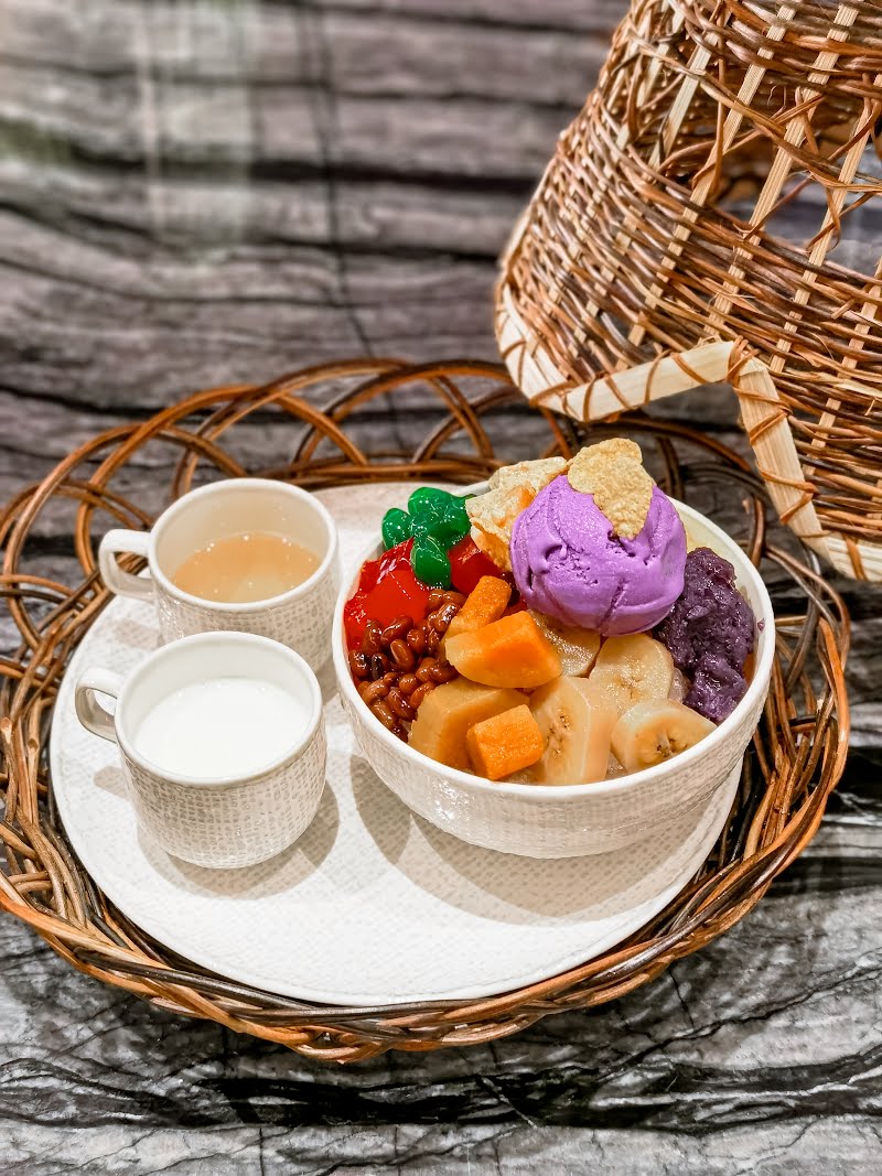 Halo-halo is often served in tall glasses or bowls, allowing the vibrant layers of ingredients to be seen. Halo-halo is a popular and colorful Filipino dessert that translates to "mix-mix" in English. It's a layered dessert that combines a variety of ingredients resulting in a delightful mix of flavors and textures. ? Photo by Herbertkikoy, CC BY-SA 4.0, via Wikimedia Commons