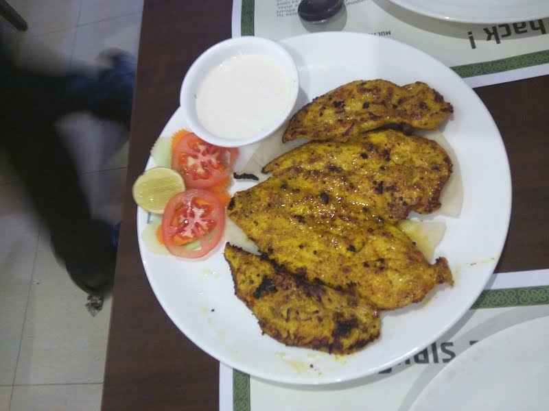 It is dajaj mashwi, an Arabian Kabab ? Photo by Ayyappannagamani, CC BY-SA 4.0, via Wikimedia Commons