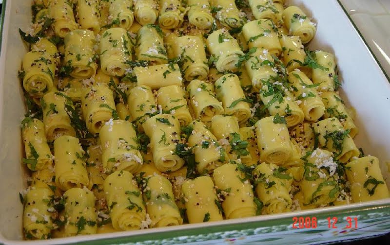 Traditional Khandvi (in Gujarati) or Surali Chya Vadya (in Marathi) is a famous Western Indian dish. It is similar to rolled pasta made from chickpea flour. It is savoured as a snack or as a starter and is extremely popular in Gujarat and Northwestern Maharashtra. ? Photo by w:User:Pmahale, Public domain, via Wikimedia Commons