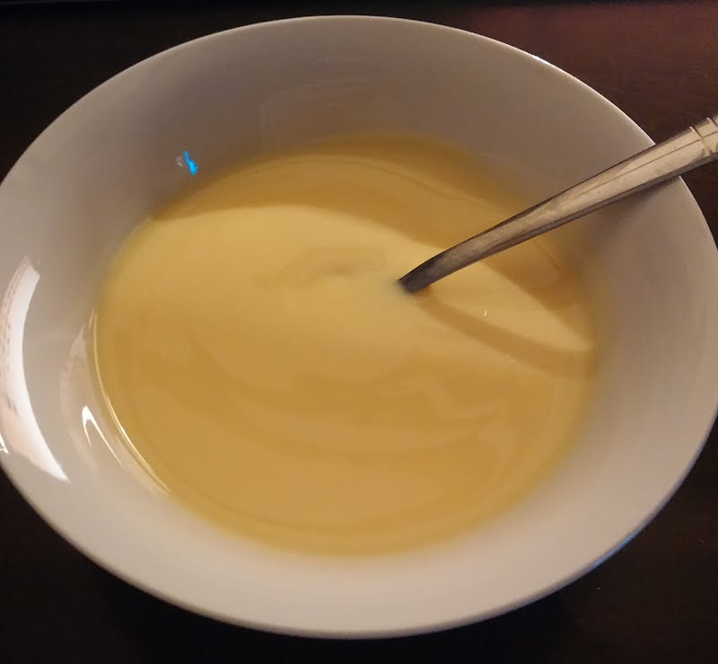 A bowl of custard with a teaspoon ? Photo by Brendan.truter, CC BY-SA 4.0, via Wikimedia Commons