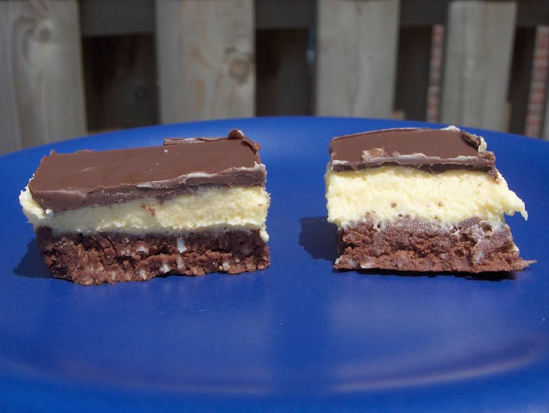 Two nanaimo bars on a blue plate ? Photo by Stephanie Spencer, CC BY 2.5, via Wikimedia Commons