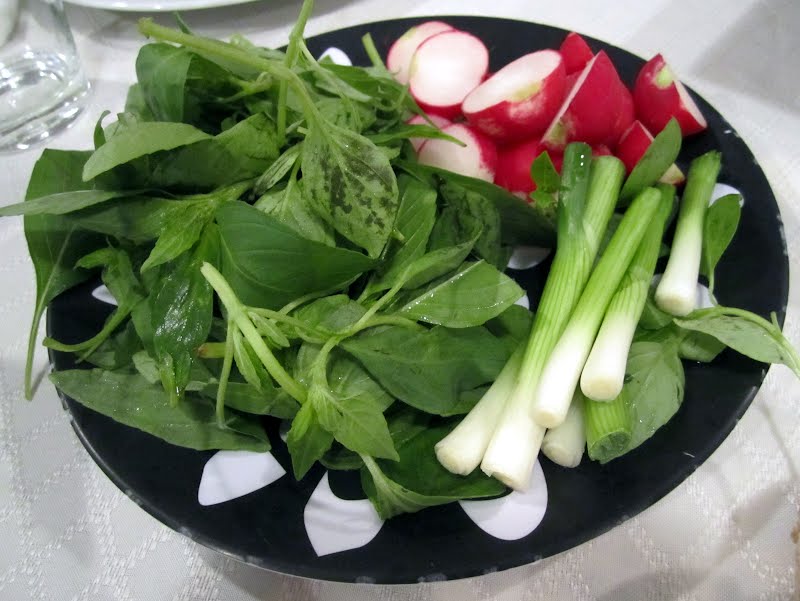 Kanachi -- fresh raw herbs as a side dish, here containing basil, green onion, and raddish ? Photo by Chaojoker, CC BY-SA 3.0, via Wikimedia Commons