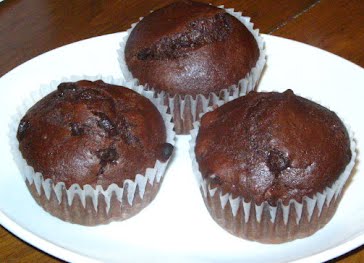 Three chocolate chocolate chip muffins. ? Photo by No machine-readable author provided. Morgan695~commonswiki assumed (based on copyright claims)., CC BY-SA 3.0, via Wikimedia Commons