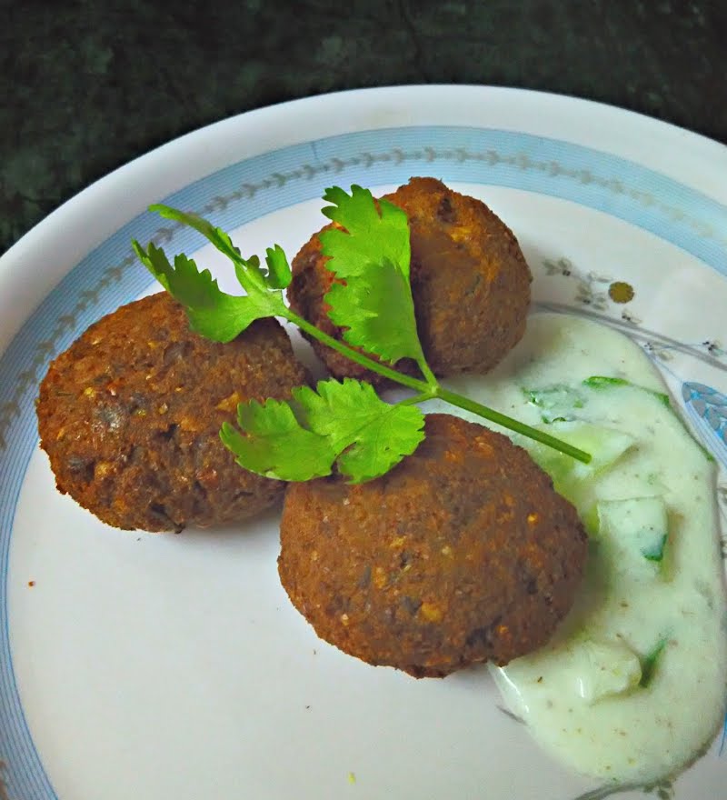 Indian Kofta with a side serving of Raita and garnished with coriander leaves. ? Photo by Rashmeet Kaur, CC BY-SA 4.0, via Wikimedia Commons