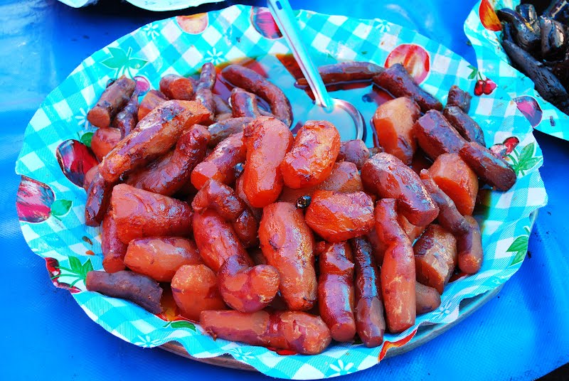 Candied yams (called camotes) in syrup for sale at a tianguis market in Metepec, Mexico State ? Photo by Thelmadatter, CC BY-SA 3.0, via Wikimedia Commons