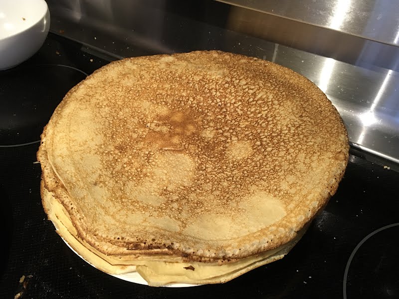 a stack of freshly made crepes