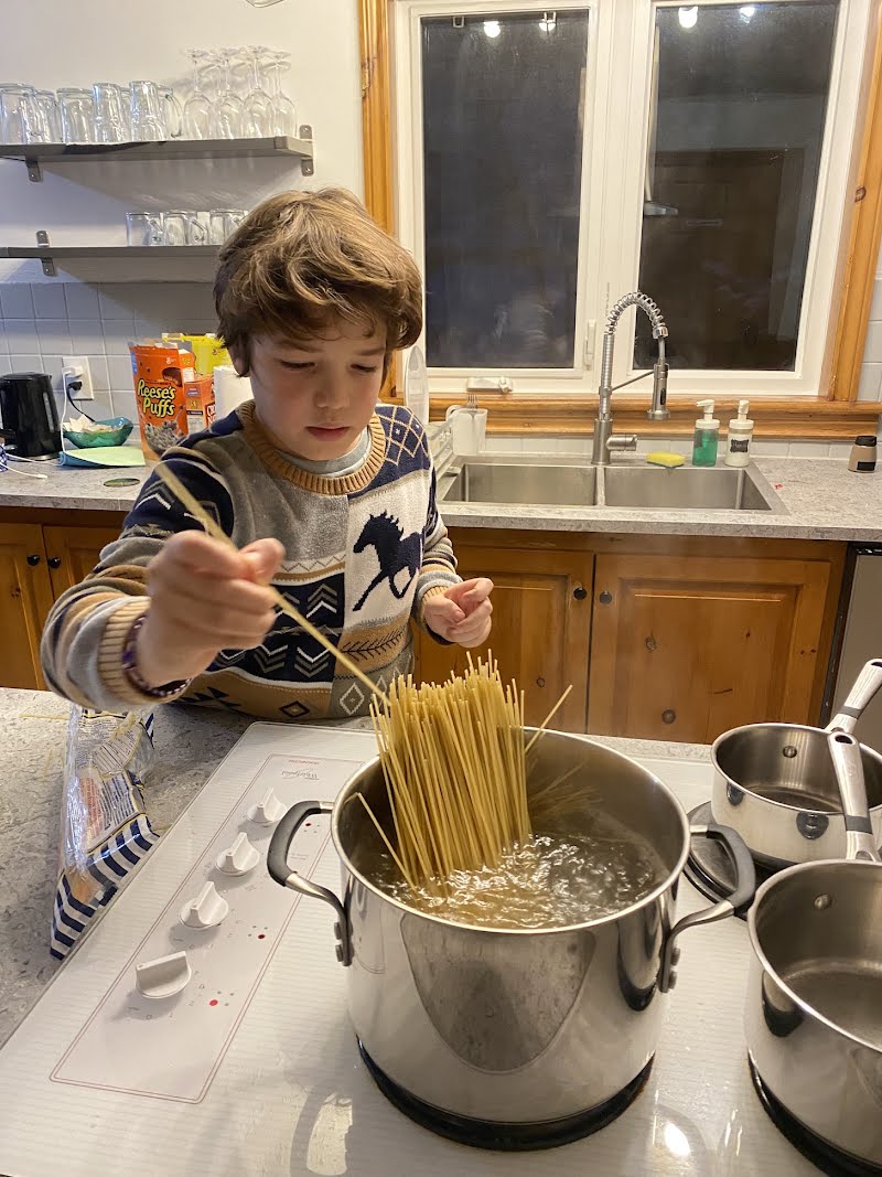 an aspiring chef making pasta