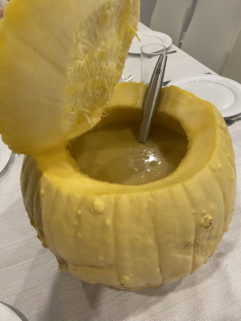 Pumpkin soup, served in a pumkin.