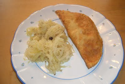 fleischkrapfen on plate ? Photo by cooking_lady

Original uploader was Brite33bb at en.wikibooks, CC BY-SA 3.0, via Wikimedia Commons