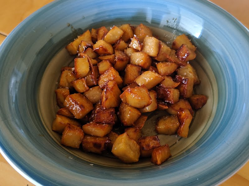 This is an image of a bowl of chopped sweet potato that has been sauteed with honey. ? Photo by Alikiiaa, CC0, via Wikimedia Commons