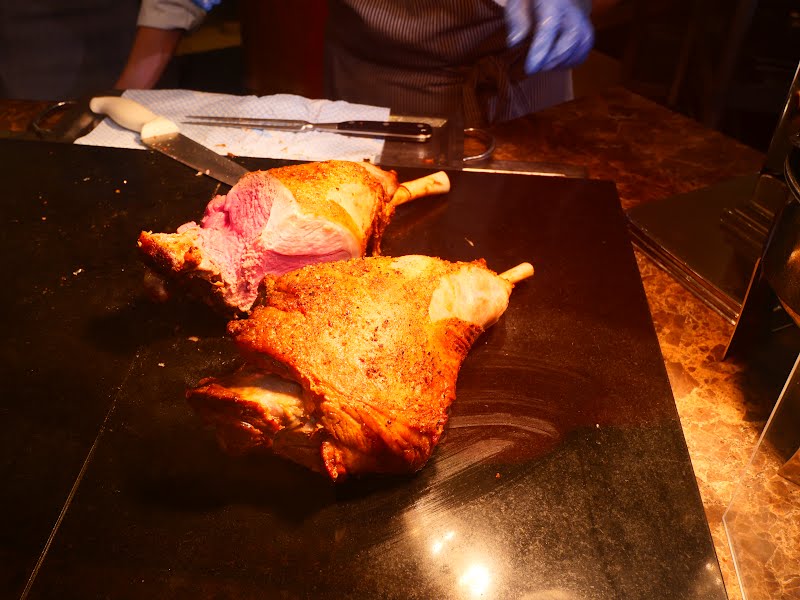 Two of roasted lamb legs in lunch buffet on the greenery in The Royal Garden ? Photo by Peachyeung316, CC BY-SA 4.0, via Wikimedia Commons