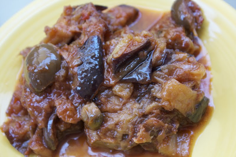 sicilian vegetarian dish with eggplant, olive, onion, caper, celery ? Photo by Massimoweb, CC BY-SA 3.0, via Wikimedia Commons