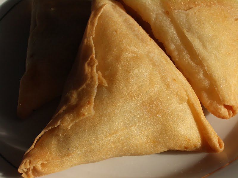 A en:samosa bought at one of the many Indian and Sri Lankan run eateries in the Parisian neighborhood of La Chapelle (Rue Louis Blanc). ? Photo by Zantastik, CC BY-SA 3.0, via Wikimedia Commons