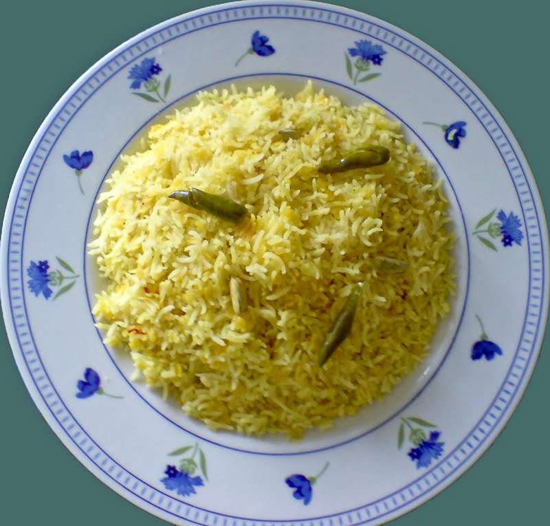 A plate of Khichuri, note vibrant yellow colour. ? Photo by Drriad, CC BY-SA 3.0, via Wikimedia Commons