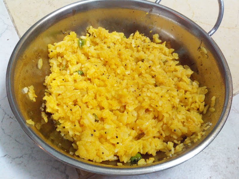 cooked spicy rice flakes, locally known as Poha or Pauva from Gujarat, India. They are also prepared in many other parts of India. ? Photo by Nizil Shah, CC BY-SA 4.0, via Wikimedia Commons