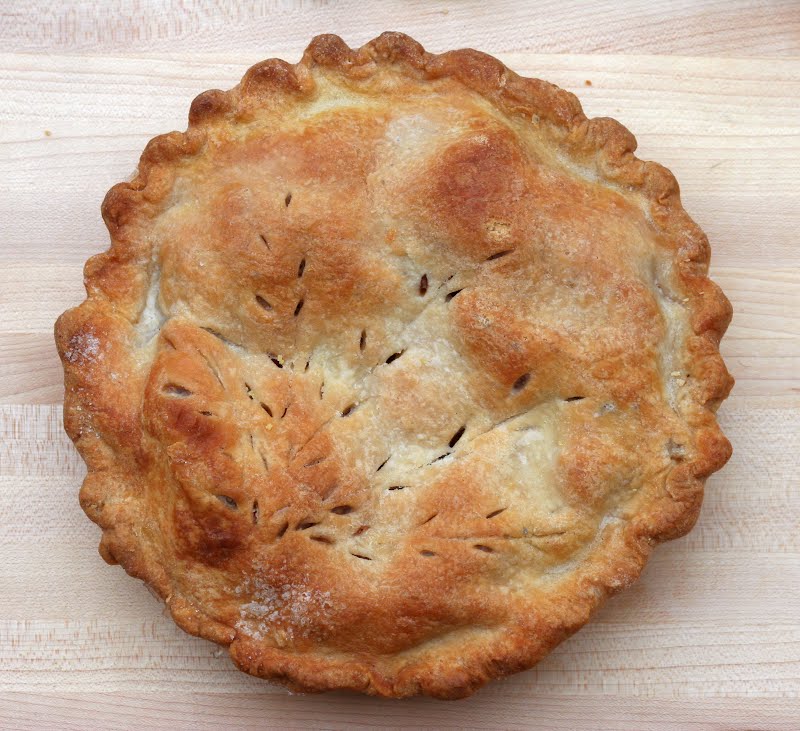 Homemade pie crust, enclosing a filling of Minnesota Haralson apples. The steam vents in a fern design is a family tradition, passed from mother to daughter for several generations, from what is now the Czech Republic to the United States. ? Photo by Jonathunder, GFDL 1.2, via Wikimedia Commons